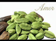 Load image into Gallery viewer, Green cardamom pods with a wooden pod on a white background, featuring the word 'Amor'. The naughty parfum for men and women - aphrodisiac - spicy woody musky leathery and strong parfum 