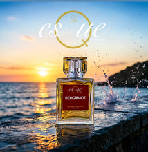 Load image into Gallery viewer, Bergamot — bright fresh citrus unisex perfume — 50ml gold glass bottle — sparkling bergamot, zesty lemon, warm amber &amp; soft musk fragrance — EsQue Parfum — styled against ocean sunset with water splashes