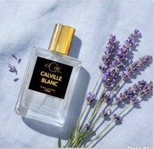 Load image into Gallery viewer, Calville Blanc — fresh clean unisex perfume — 30ml clear glass bottle with gold cap — crisp bergamot , fresh lavender, soft citrus &amp; white musk fragrance — EsQue Parfum — styled with lavender sprigs on light linen fabric 