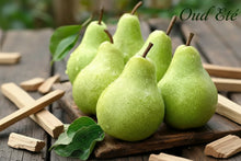 Load image into Gallery viewer, Green pears on a wooden surface with 'Oud Ete' label - fruity , fresh , light summery blend - affirmation is joy - a happy smell 